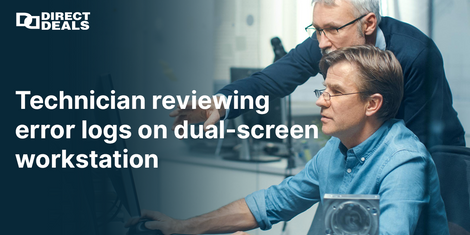 Technician reviewing error logs on dual screen workstation