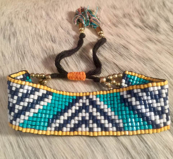 Hand Made Beaded Bracelet with a Tassel Pull Closure