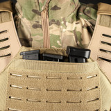 valken molle laser cut plate carrier tan closeup holding pistol magazines