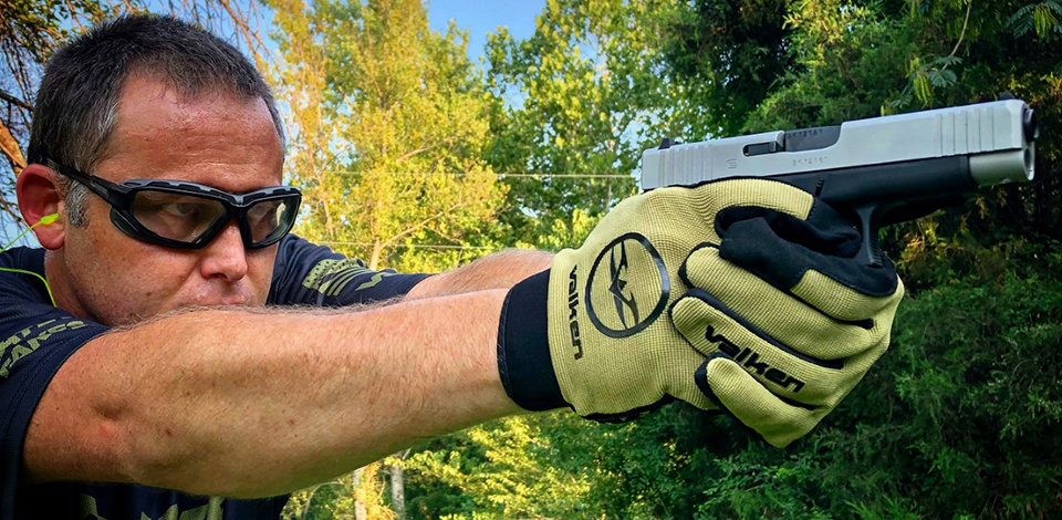 Josh from Valken shooting a Glock pistol wearing Valken gloves and Echo airsoft goggles