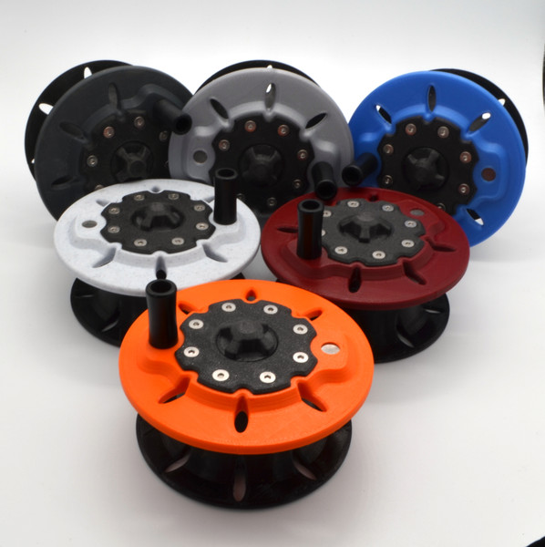 A variety of colors of El Hefe 3D printed fly reel spare spools