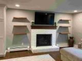 Creating an Organized and Stylish Basement Entertainment Area with Floating Shelves