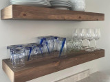 Can floating shelves hold glasses and dishes?