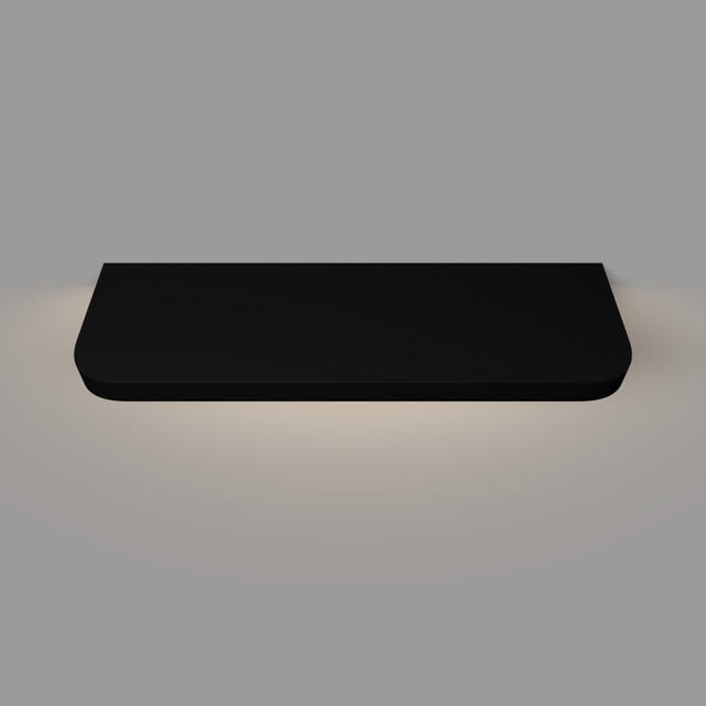 Top-down view of a black painted floating shelf with integrated lighting and gently rounded radius front corners, highlighting the smooth finish and depth.