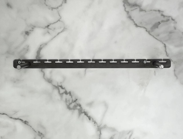 Top view of the heavy-duty metal floating shelf bracket included with the 2-inch thick LED-lit shelf, designed for concealed mounting and strong wall support.