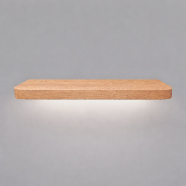 Front view of a radius-corner red oak floating shelf with integrated LED downlighting in an unfinished look, showing natural grain detail, raw wood texture, and an illuminated underside.