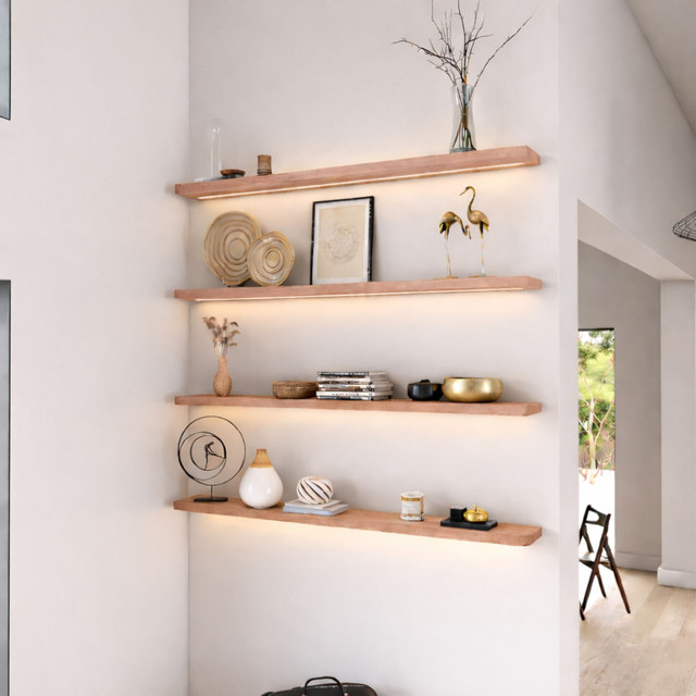 1.625-inch thick red oak floating shelves with rounded edges and built-in LED lighting, blending natural warmth with modern function. The subtle glow accentuates grain variation and adds inviting ambiance to the living space.