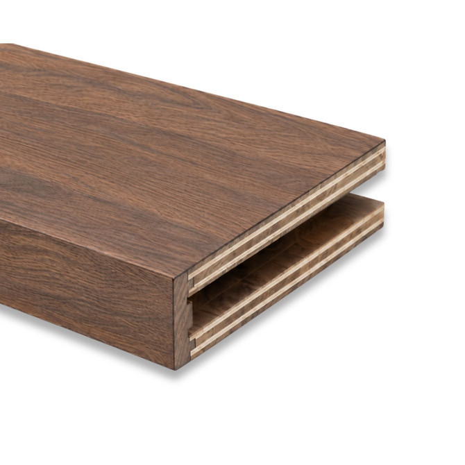 Close-up of a 3-inch Walnut alcove floating shelf in Clear Coat showing the open end and routed channel for side cleat installation.
