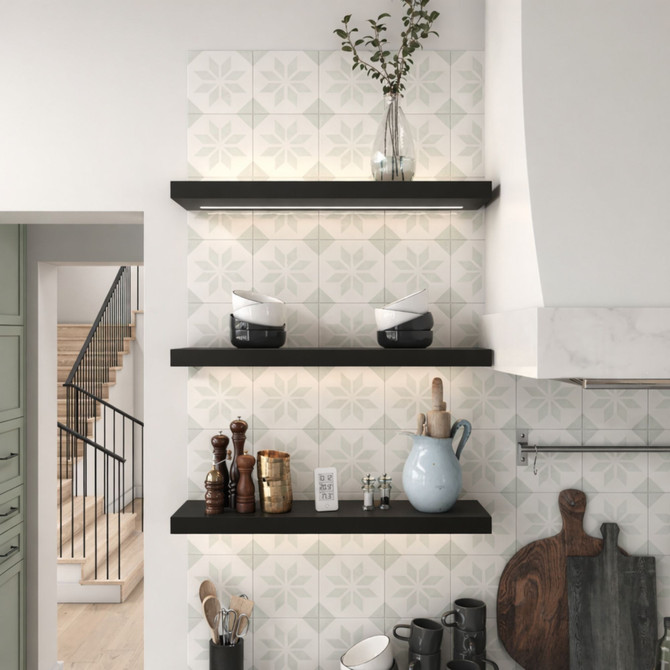 2 inch thick painted black floating shelves with integrated LED lighting in a kitchen. The sleek, modern finish creates striking contrast against lighter surfaces, while the integrated LED lighting enhances visibility and adds contemporary depth to the kitchen design.