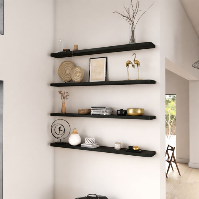 1 5/8-inch thick floating shelves with softly rounded radius corners, painted black and styled in a modern living space. The smooth, curved edges add a subtle design detail, while the rich black finish creates bold contrast and contemporary depth.