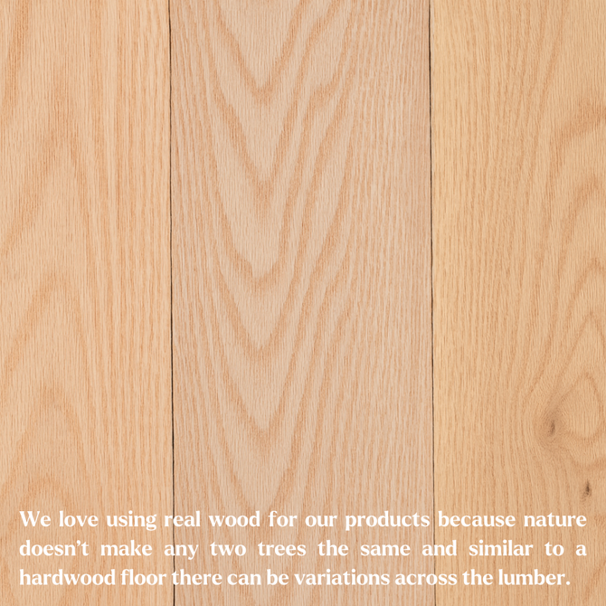 Unfinished red oak planks displayed side by side, showing natural variation in wood grain and color.