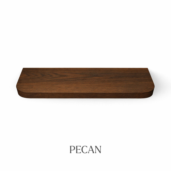 Top view of a radius-corner red oak floating shelf, finished in pecan, showing warm dark-brown tones and wood grain detail.