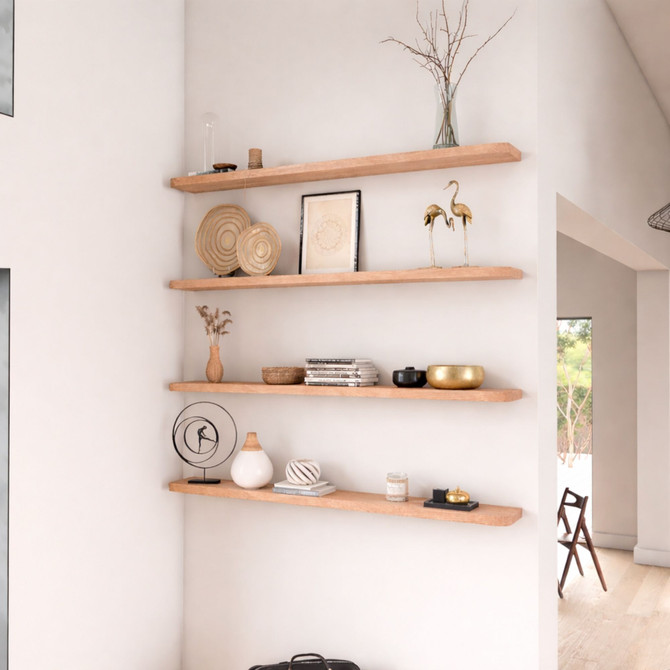 1 5/8-inch thick solid red oak floating shelves featuring gently rounded radius corners. The softened edges complement the pronounced open grain and warm pinkish-red undertones, adding organic warmth and timeless character to the room.