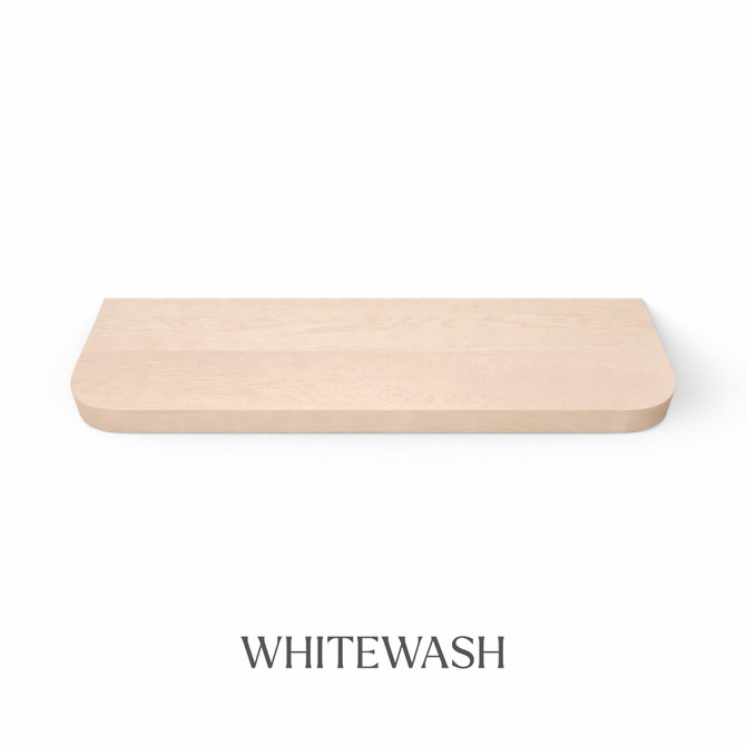 Top view of a radius-corner red oak floating shelf with integrated LED lighting, finished in whitewash, showing subtle grain detail and light color variation.