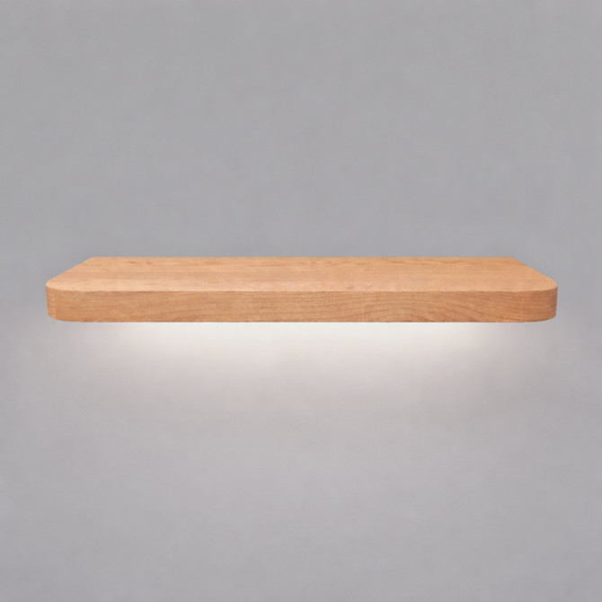 Front view of a radius-corner red oak floating shelf with integrated LED downlighting in an unfinished look, showing natural grain detail, raw wood texture, and an illuminated underside.