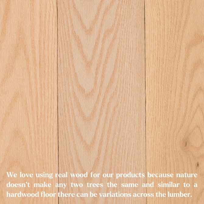 Unfinished red oak planks displayed side by side, showing natural variation in wood grain and color.