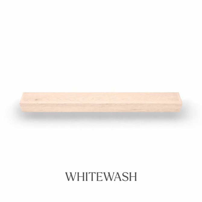 Top view of a 5-inch thick red oak floating mantel finished in whitewash, showing subtle grain and light color variation.