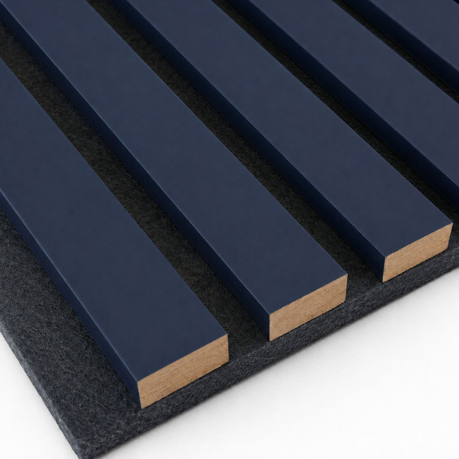 Close-up of navy painted slat wall panel showing the deep blue finish, 1-inch slats, and dark textured acoustic felt backing.