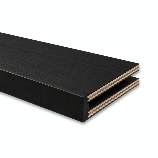 Close-up of a 3-inch Maple alcove floating shelf in Painted Black showing the open end and routed channel for side cleat installation.
