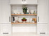 j thomas home superior alder 1 5/8” thick floating shelves installed in between two kitchen cabinets