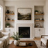 Superior alder alcove floating shelves installed in recessed built-in shelving areas on both sides of a fireplace.