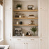 2-inch White Oak alcove floating shelves installed in a built-in kitchen coffee bar with white cabinetry.