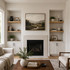 2-inch White Oak alcove floating shelves installed in built-in niches on both sides of a living room fireplace.