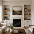 2-inch Rustic Alder alcove floating shelves in Clear Coat installed in built-in niches on both sides of a living room fireplace.