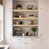 3-inch Superior Alder alcove floating shelves installed in a built-in kitchen coffee bar with white cabinetry.