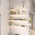 1.625-inch thick white floating shelves with curved corners and built-in LED illumination. The soft edge detail and warm under-light create a clean, elevated look with subtle dimension.
