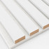 Close-up of white painted acoustic slat wall panels showing the satin finish, MDF core, and white acoustic felt backing.