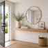 Bright modern entryway featuring white acoustic slat wall panels paired with a floating white oak shelf, round mirror, and coastal-inspired décor.