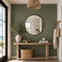 Coastal-inspired entryway with Jade acoustic slat wall panels, a natural wood console table, round mirror, and neutral décor.