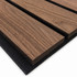 Close-up of Walnut slat wall panel showing 3-inch-wide slats, rich natural walnut grain, and black acoustic felt backing.