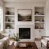 3-inch Painted White Maple alcove floating shelves installed in built-in niches surrounding a living room fireplace.