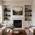 3-inch Painted Black Maple alcove floating shelves installed in built-in niches surrounding a living room fireplace.