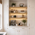 3-inch White Oak LED-lit alcove shelves installed in a built-in kitchen coffee bar with recessed under-shelf lighting.