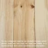 Natural pine wood boards showing light color variation, visible grain patterns, and knots found across real wood lumber.