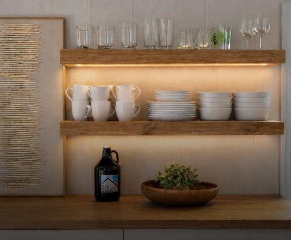 Lighted 3 inch thick shelves stacked above dining buffet