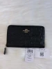 COACH BLACK EMBOSSED SIGNATURE LEATHER ZIP WALLET WITH GOLD HARDWARE - BLACK