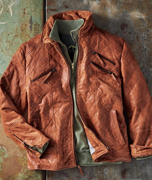 32 Bar Blues Quicker The Better, brown leather quilted jacket with multiple zippered pockets and green inner lining.