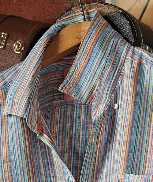 32 Bar Blues Zing, close-up of a colorful, striped collared shirt hanging on a wooden hanger.