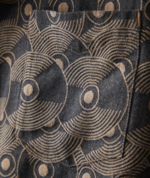32 Bar Blues Nights At the Turntable, close-up of fabric with a black and beige geometric pattern of concentric circles and lines.