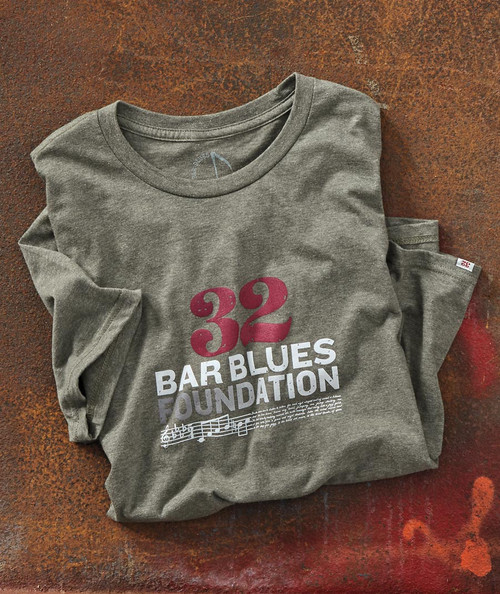 32 Bar Blues Foundation T-Shirt, folded gray t-shirt with red and white text and musical note graphic.