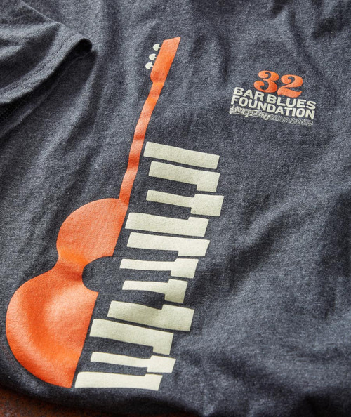 Product 32 Bar Blues Boogie Duo, graphic t-shirt featuring a vintage design of a guitar and piano keys representing blues music.