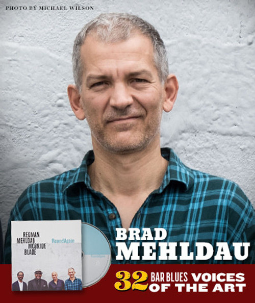 32 Bar Blues Brad Mehldau - RoundAgain, album cover featuring a portrait of Brad Mehldau in a plaid shirt against a light brick wall, with text highlighting the album and artist.