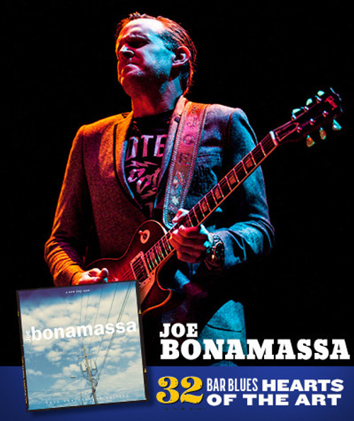 32 Bar Blues Joe Bonamassa - A New Day Now, image of a musician playing an electric guitar on stage with dramatic lighting.