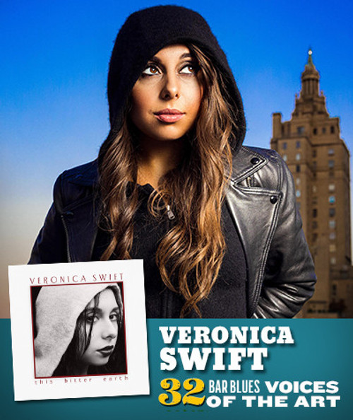 32 Bar Blues This Bitter Earth - Veronica Swift, portrait of a woman with long brown hair wearing a black beanie and black leather jacket against a city skyline background.