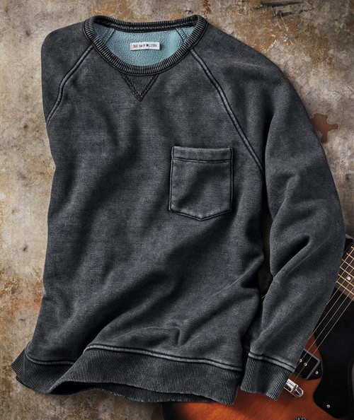 32 Bar Blues Just Live Your Life sweatshirt, dark gray crewneck apparel with a chest pocket, laid on a rustic surface, next to an electric guitar.