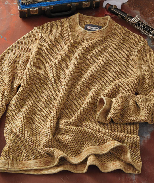 32 Bar Blues Butterscotch, a beige knitted sweater with a textured pattern laid flat on a surface.